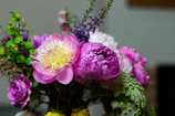 A vibrant bridal bouquet featuring soft pink peonies and eucalyptus.