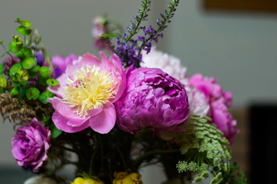 A vibrant bridal bouquet featuring soft pink peonies and eucalyptus.