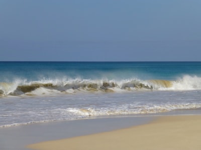 shoreline and ocean waves during daytime cabo verde google meet background