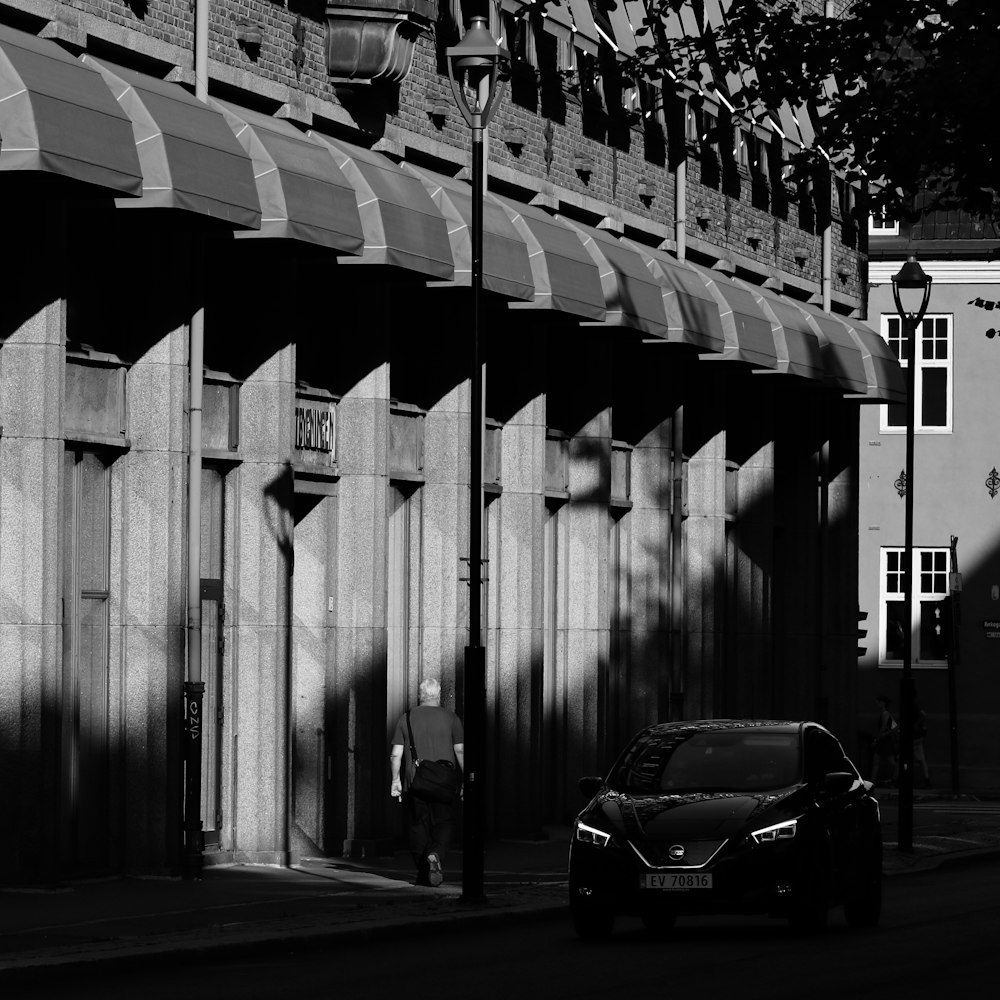 grayscale photography car on road