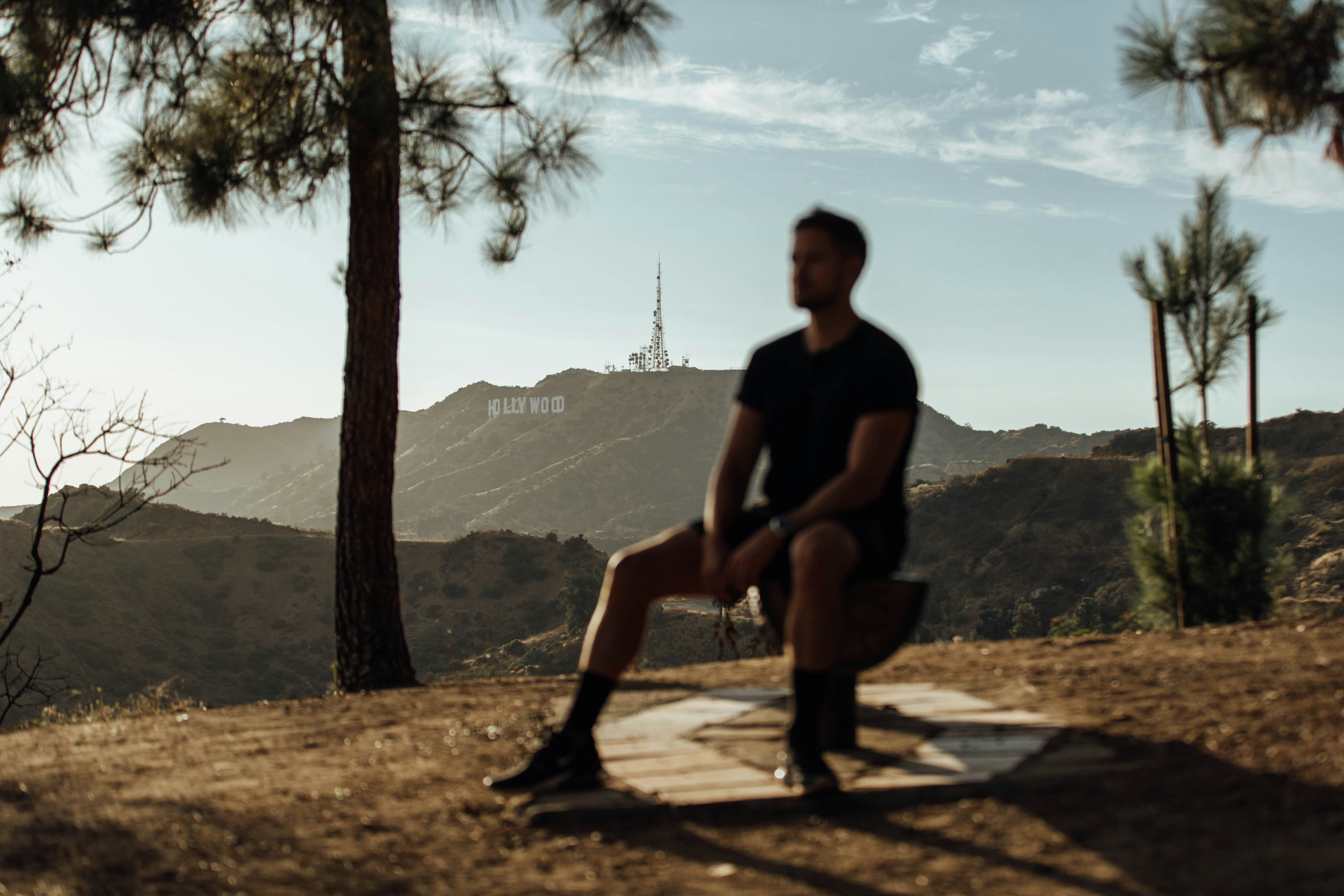 man wearing black shirt sitting on chair, Taking a break from a hike in Griffith Park, California.</p><p>If you find my photos useful, please consider subscribing to me on YouTube for the occasional photography tutorial and much more - https://bit.ly/3smVlKp - I