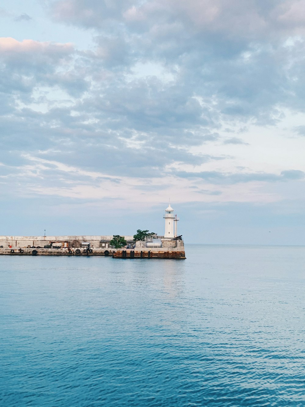 lighthouse near body ofwater