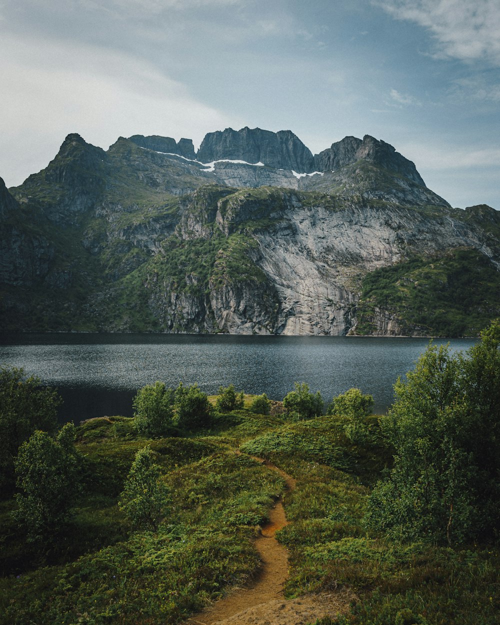 mountains near body of water