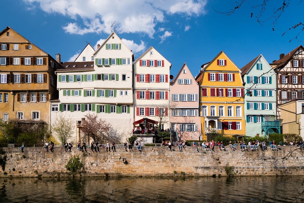 a row of colorful buildings next to a body of water