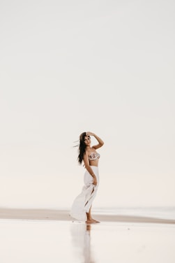 A serene beach scene in Goa showcasing elegant modest fashion pieces.