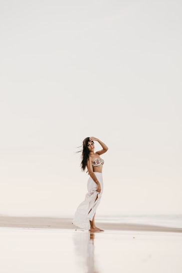 A serene beach scene in Goa showcasing elegant modest fashion pieces.