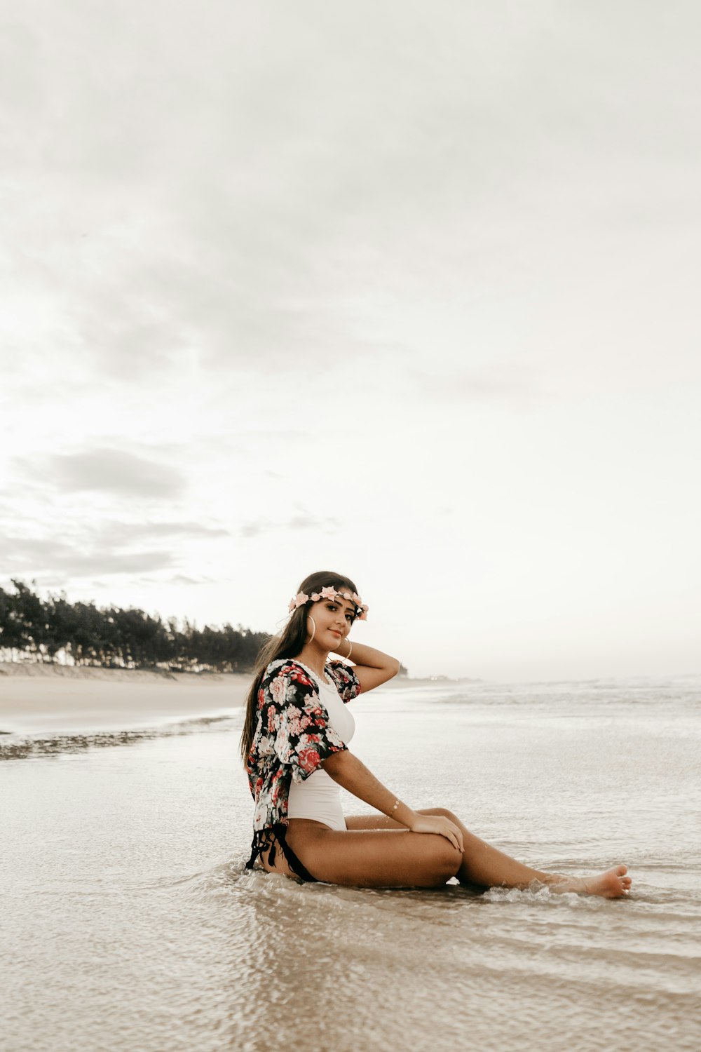 woman sitting on shore