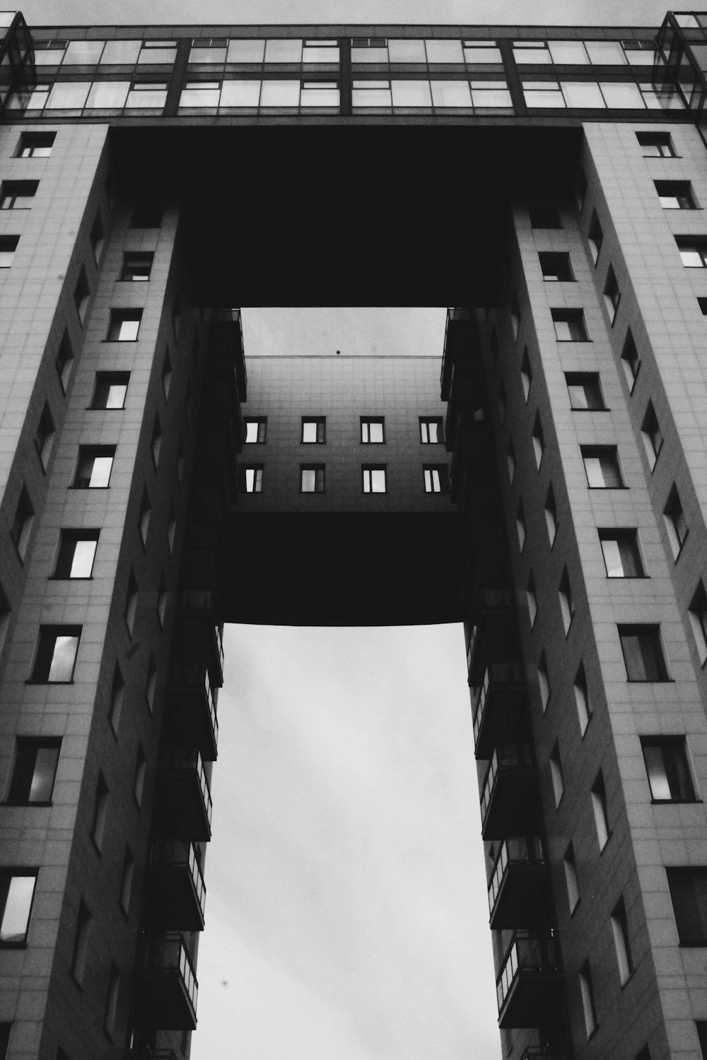 grayscale photography of high rise building