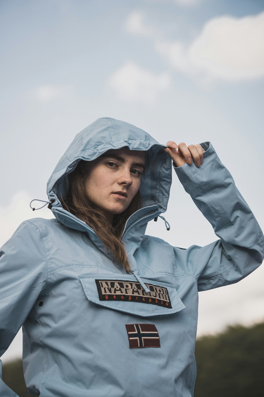 woman wearing teal pullover hoodie