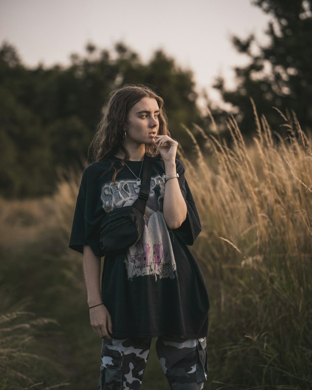 woman in black on a wheat field