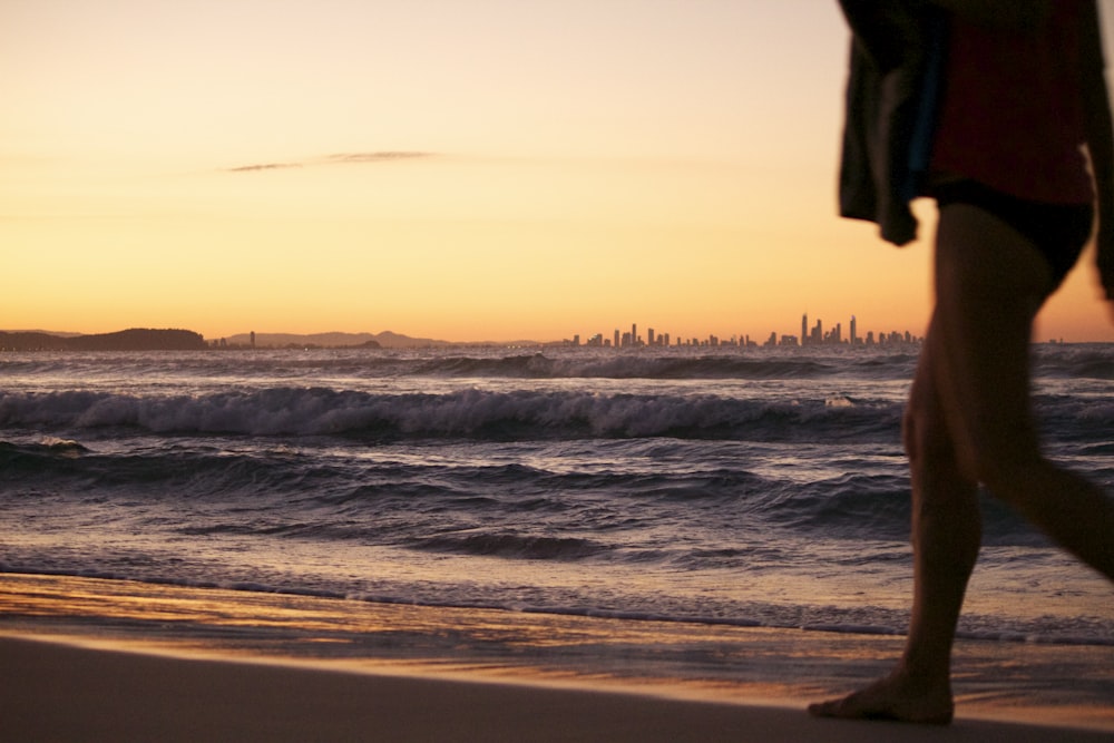 woman walking on shore