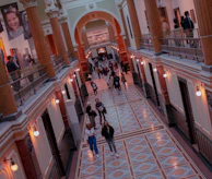 A warm, inviting hallway in the center decorated with community art and photos.