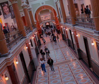 A warm, inviting hallway in the center decorated with community art and photos.