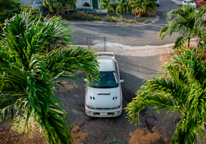 Scenic view of a rental car parked in front of a cozy Orlando vacation home.