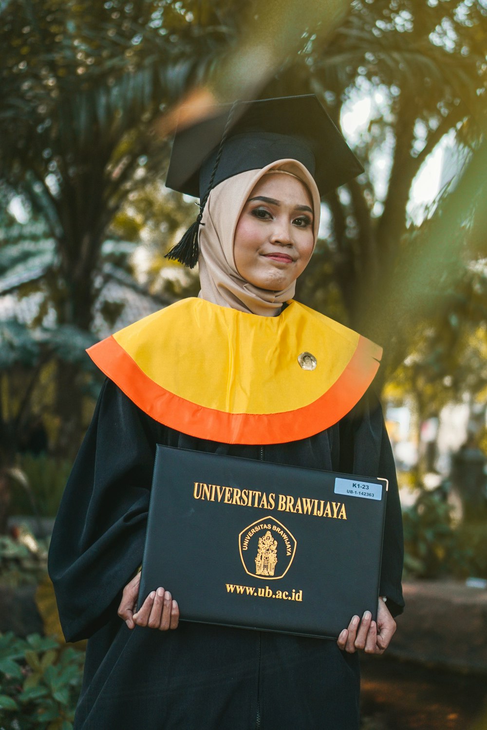 woman wearing academic dress and hijab headscarf