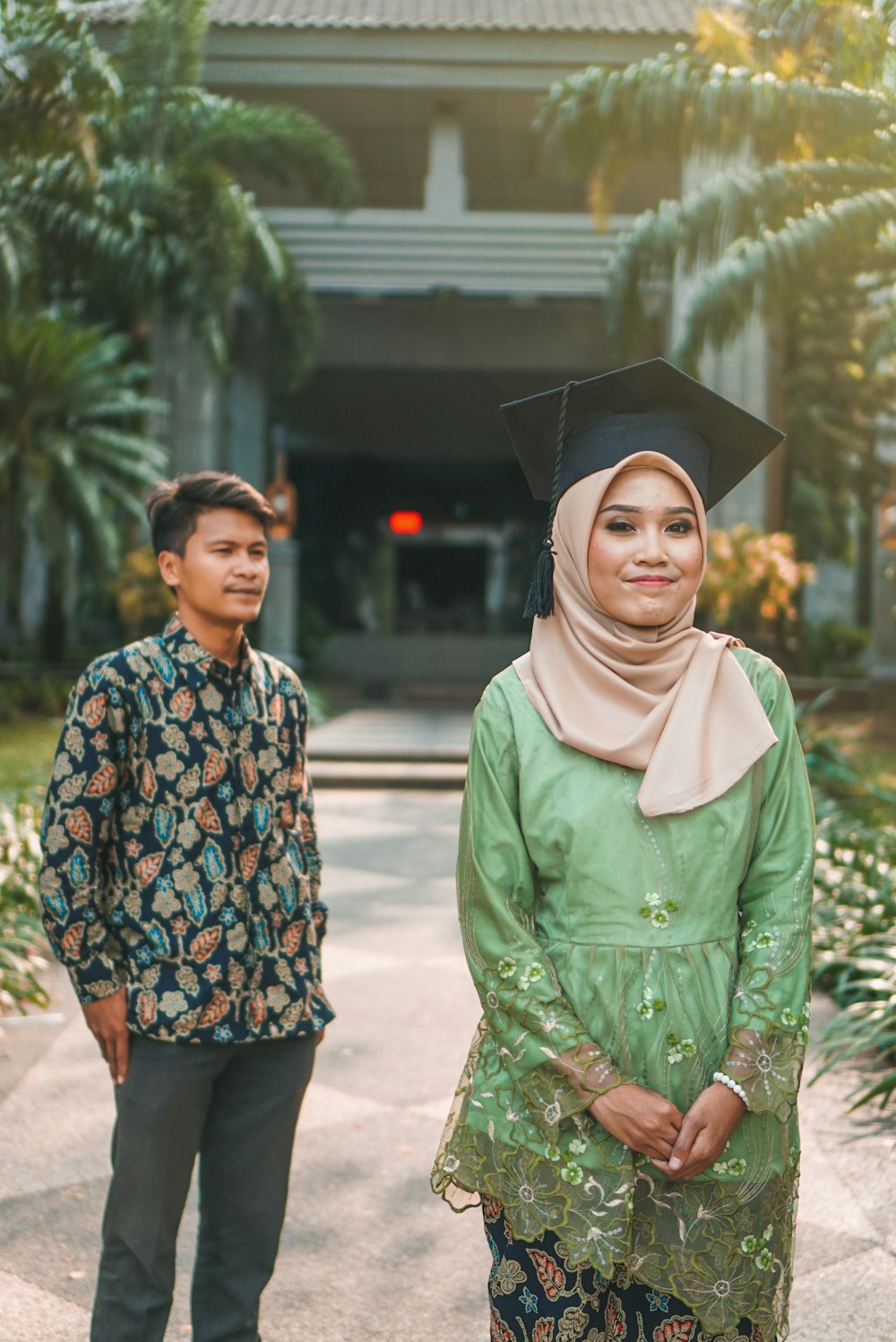 man and woman standing outdoor during daytime