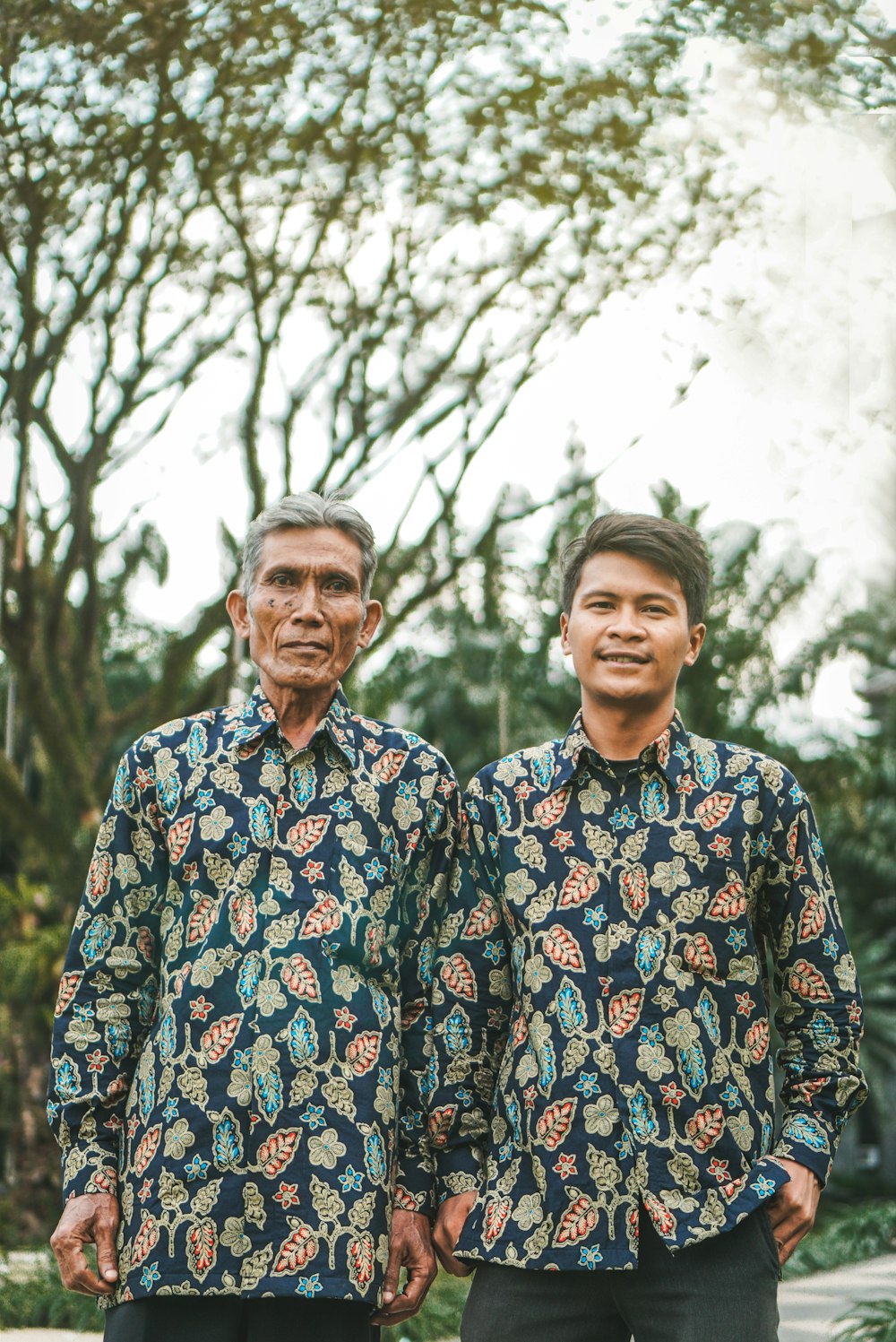 two men standing outdoor during daytime