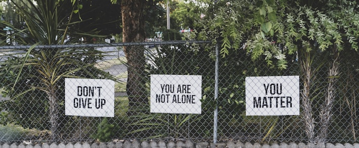 don't give up. You are not alone, you matter signage on metal fence