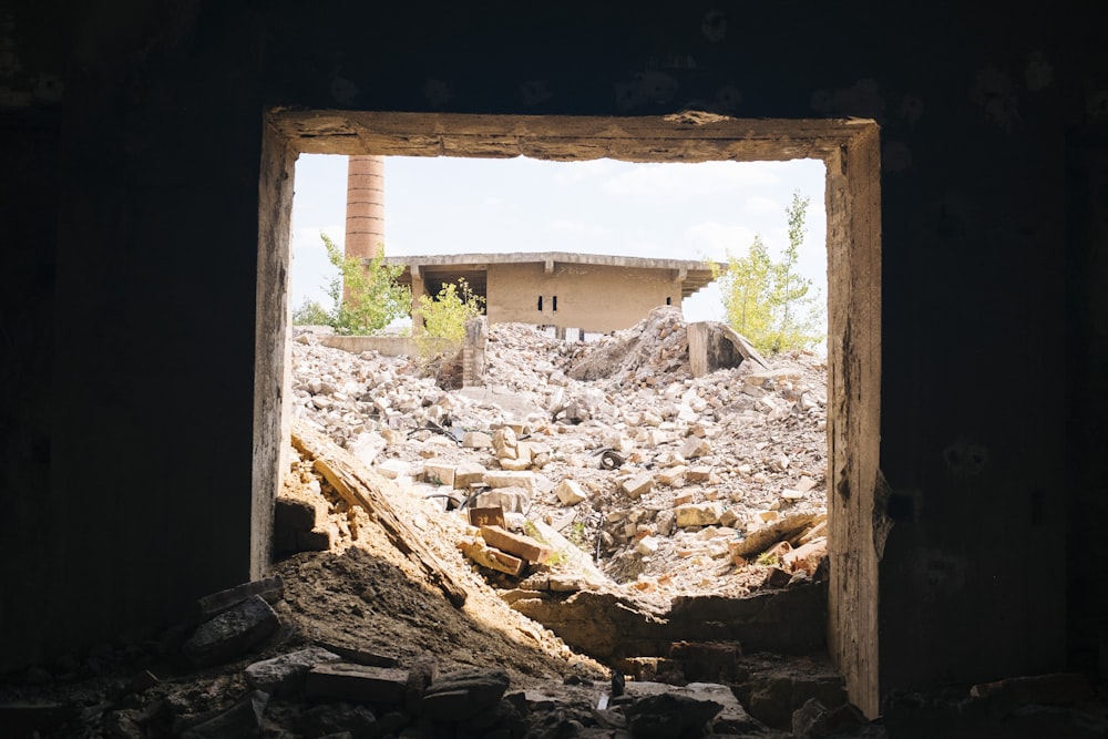a view of a building through a hole in a wall