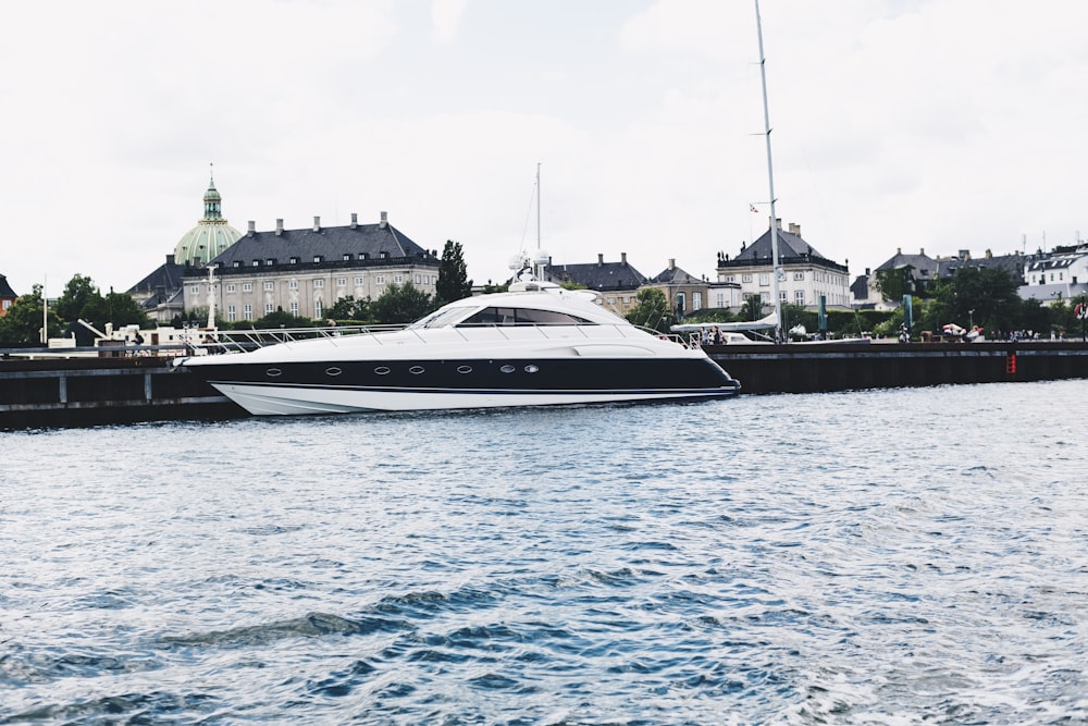 white and black ship on body of water during daytime