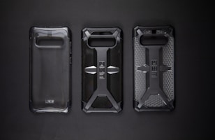 A close-up of a rugged phone case protecting a mobile device against drops and scratches.