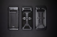 A hand showcasing a drop-proof phone case against a vibrant background.