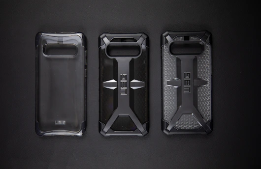 Sturdy dual-layer phone case shown protecting a smartphone against drops.