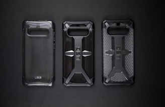 A collection of durable phone cases and anti-impact screen protectors arranged neatly.