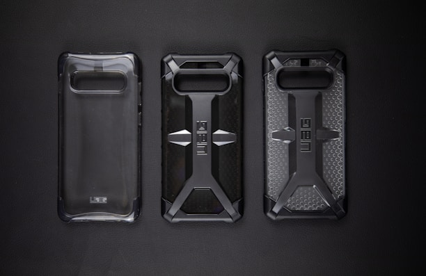 A collection of durable phone cases and anti-impact screen protectors arranged neatly.