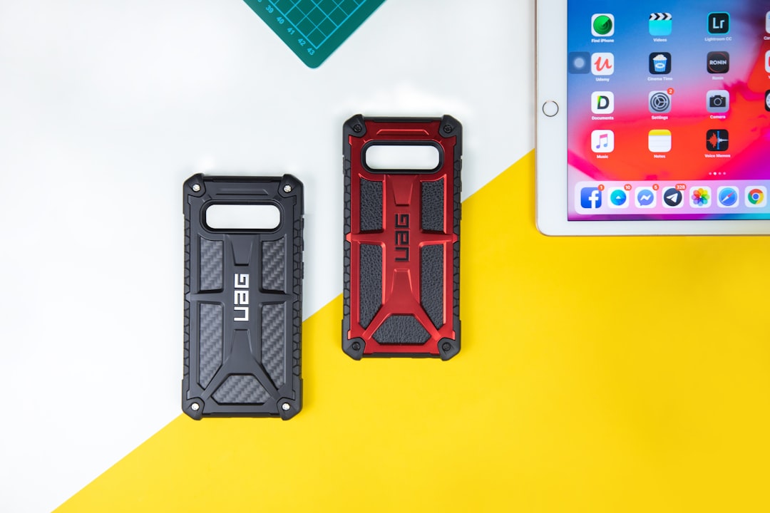 two black and red UAG smartphone cases