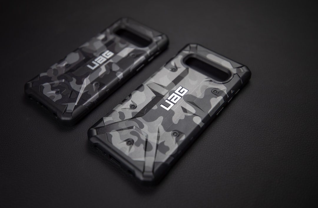 two assorted-color UAG phone cases