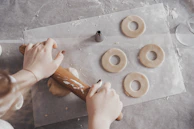 A baking basics session with dough being rolled out and decorated with fresh fruit toppings.