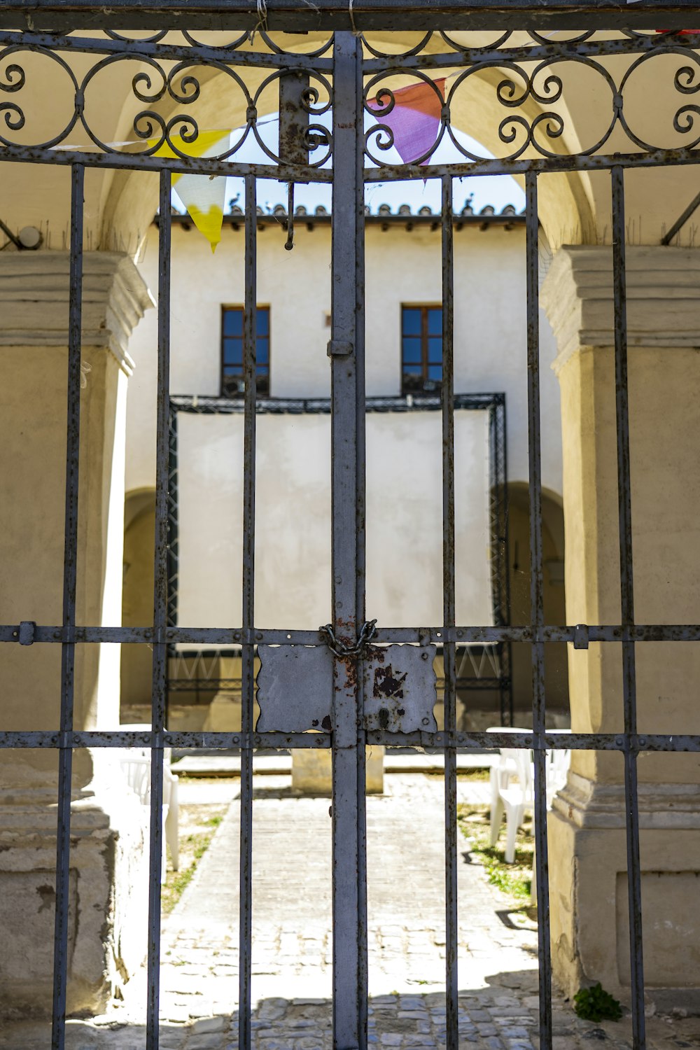 gray metal gate during daytime