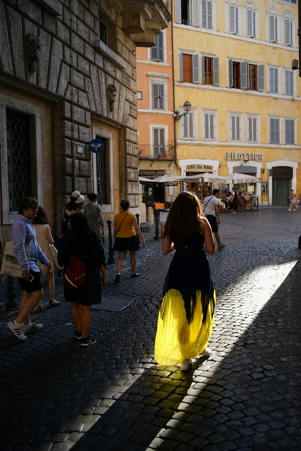 woman walking on pavement