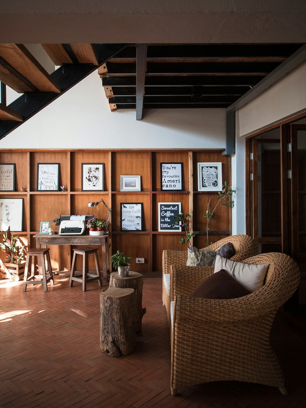 two vacant brown wicker armchairs in room