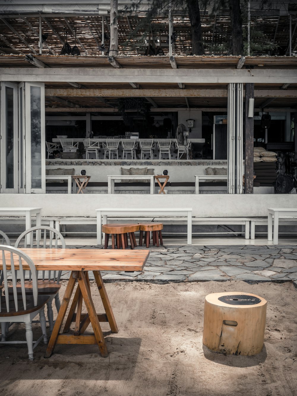 a table and chairs sitting outside of a building