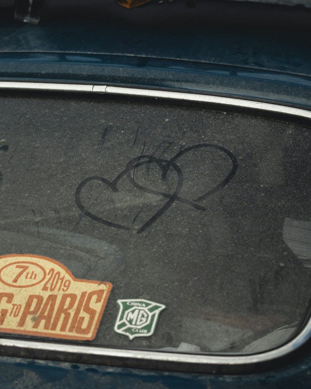 a close up of a car with graffiti on it