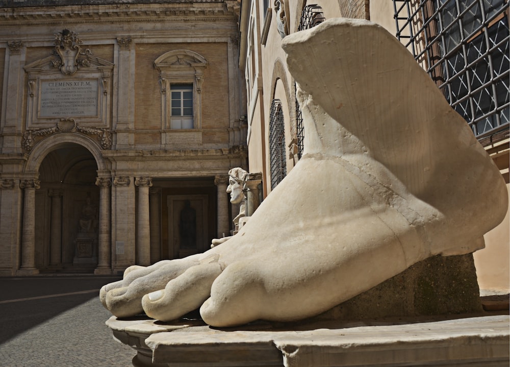 gray concrete foot statue