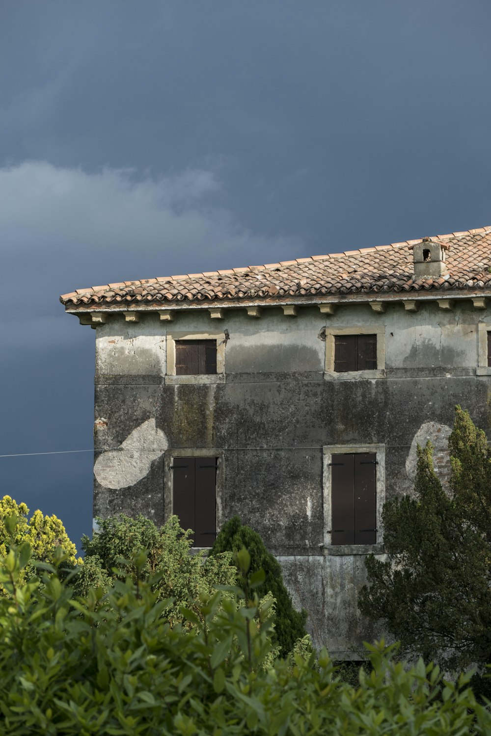 an old building with a clock on the side of it