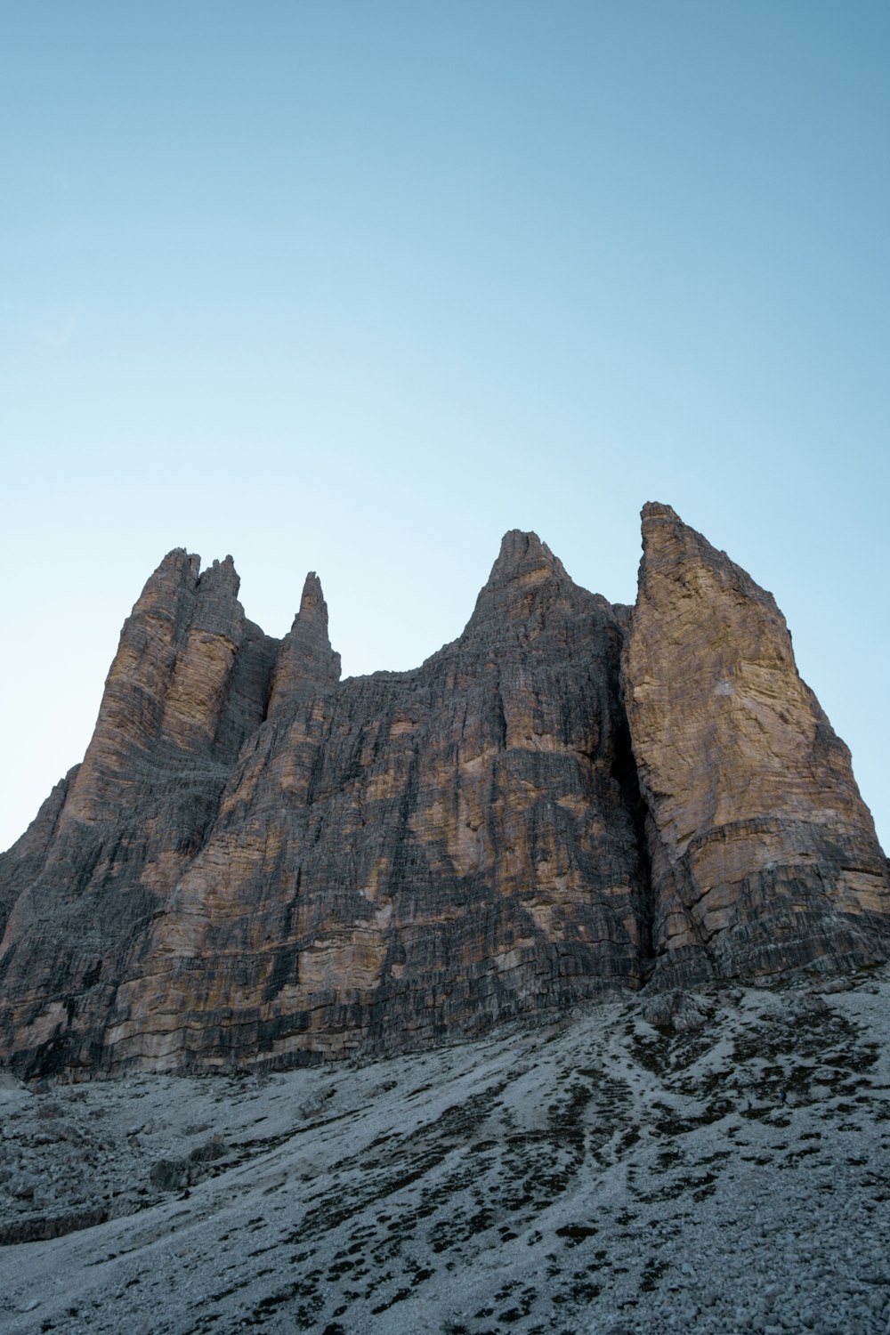 a very tall mountain with a sky in the background