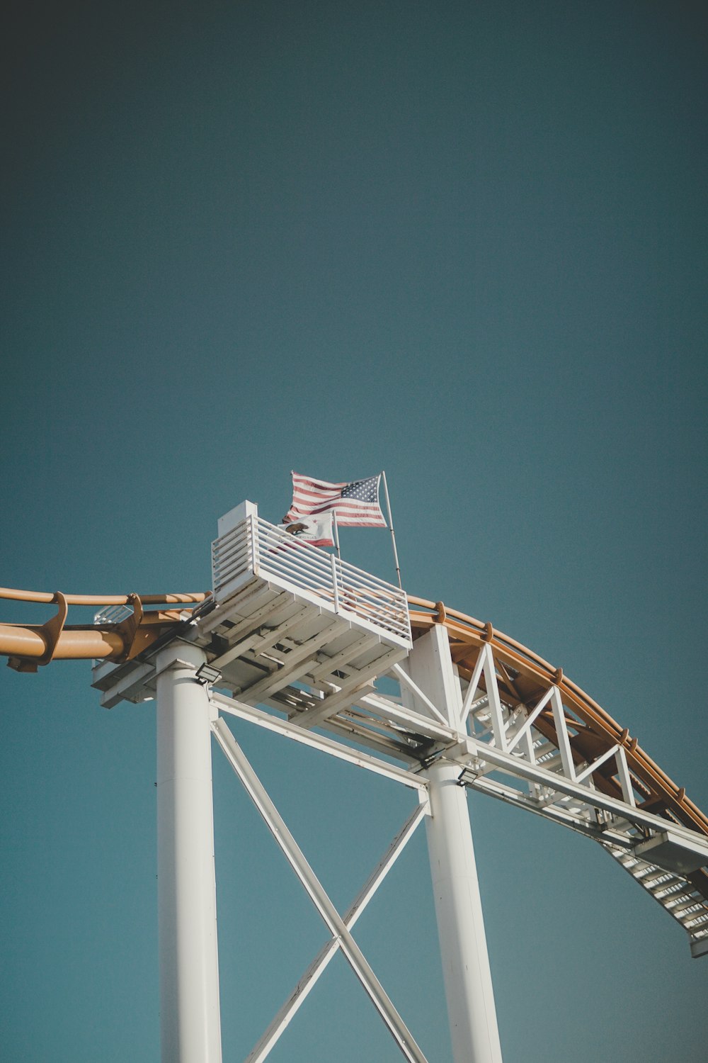 waving USA flag in roller coaster rail