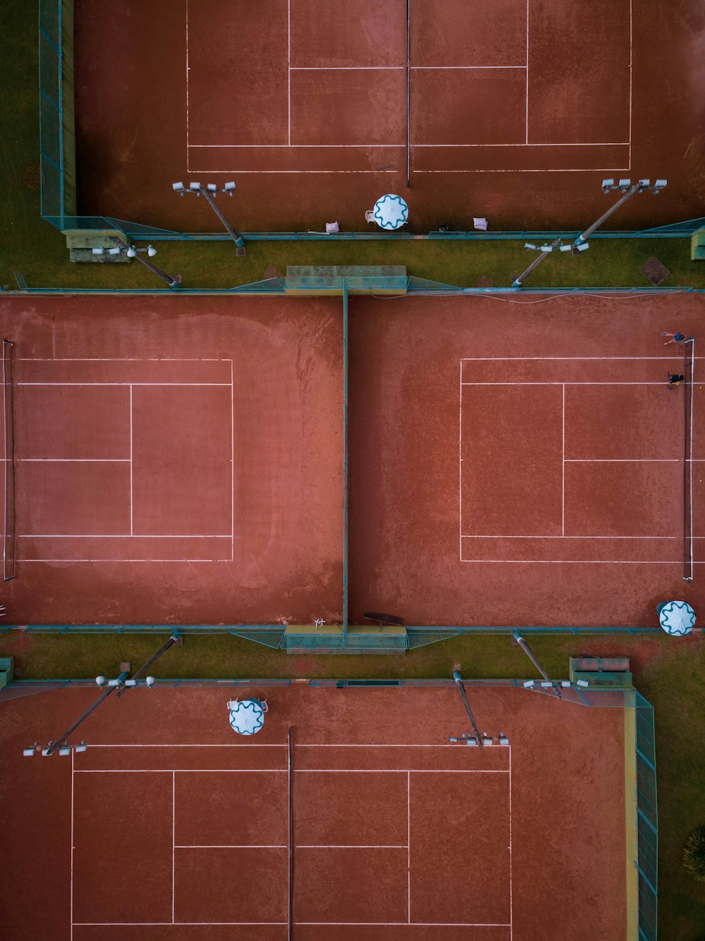 aerial view of four tennis courts