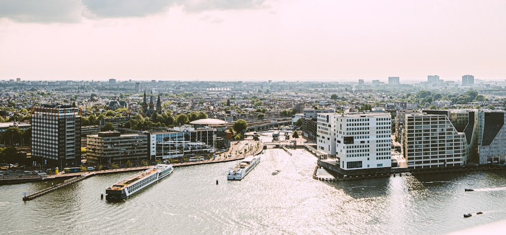 a river running through a city next to tall buildings