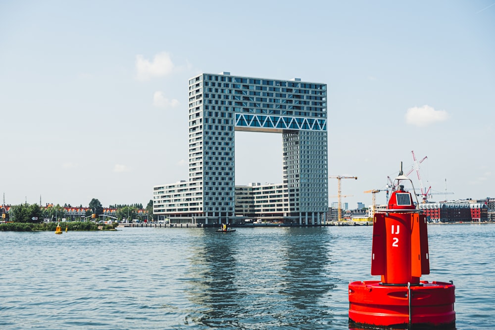 body of water near high buildings at daytime