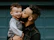 man carrying baby boy and kissing on cheek
