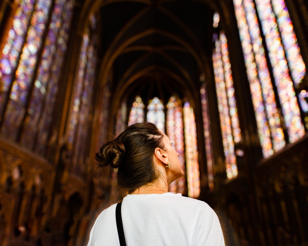 selective photography of woman in white top