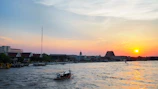 A serene boat ride along the Tonle Sap lake at sunset.