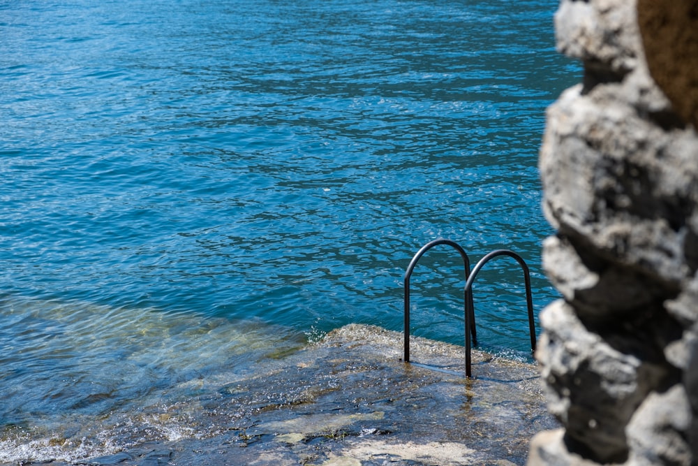 a pair of metal bars sticking out of the water