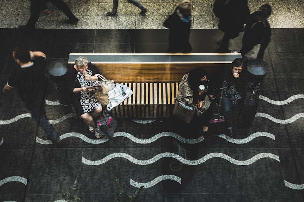 people walking near desk