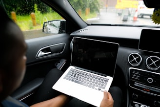 person holding MacBook